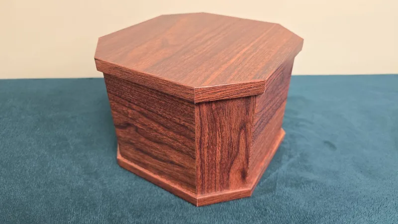 A hexagonal casket in a darker wood